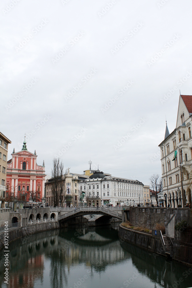 Ljubljana city in the evening. Cityscape with bridge. Slovenia winter 2019.