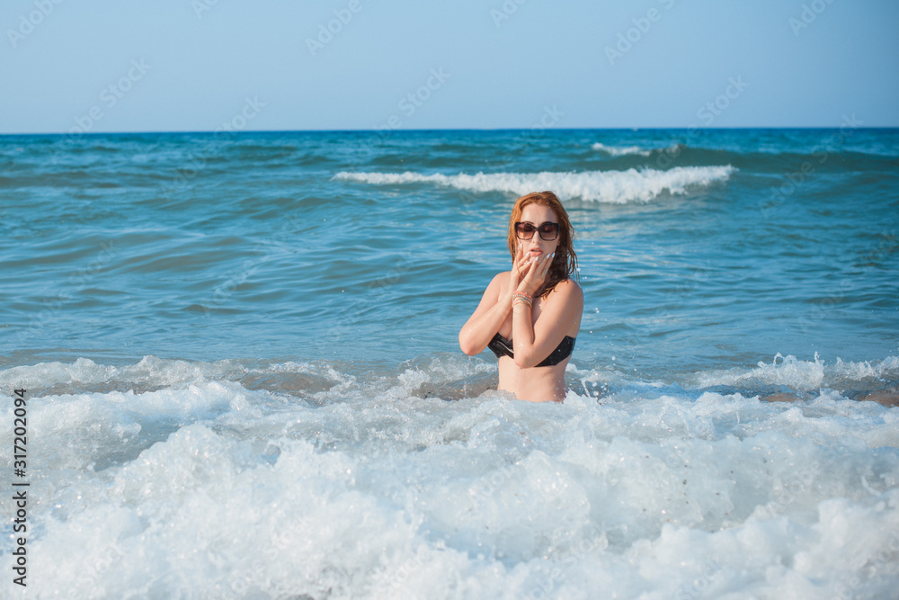 Plus size nice young woman with full hips and pretty figure in fashionable swimsuit rest at sea, vacation and trip concept Plus size nice young woman with full hips and pretty figure in fashionable swimsuit rest at sea, vacation and trip concept