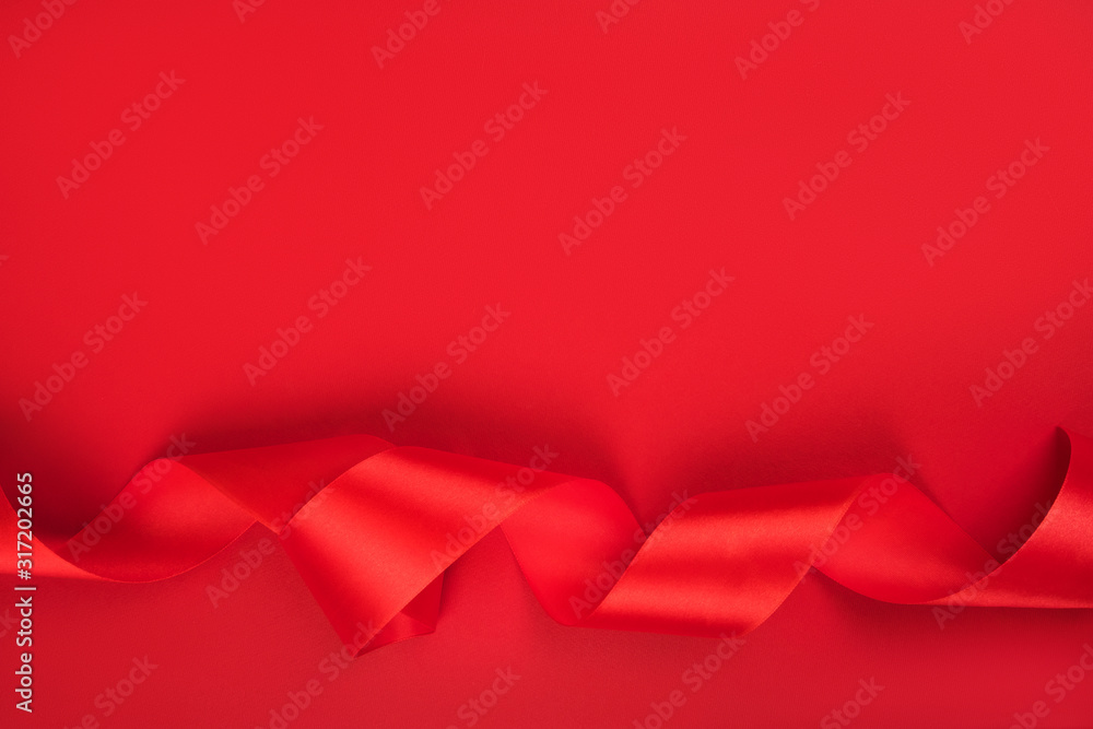 Curly red ribbon background Curly red ribbon background