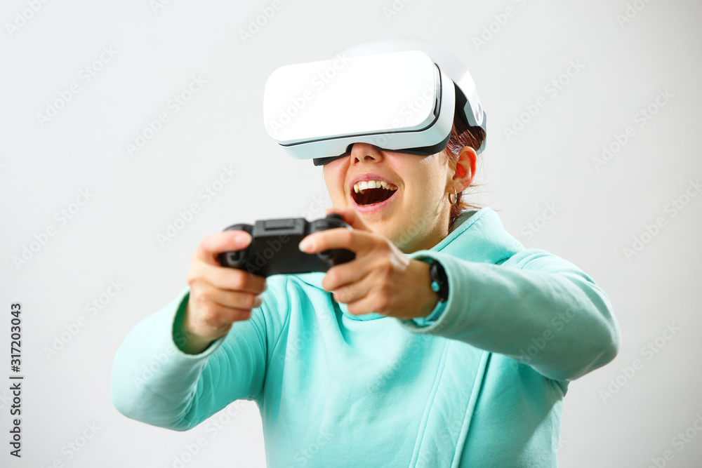 Woman with virtual reality headset is playing game. Woman with virtual reality headset is playing game.