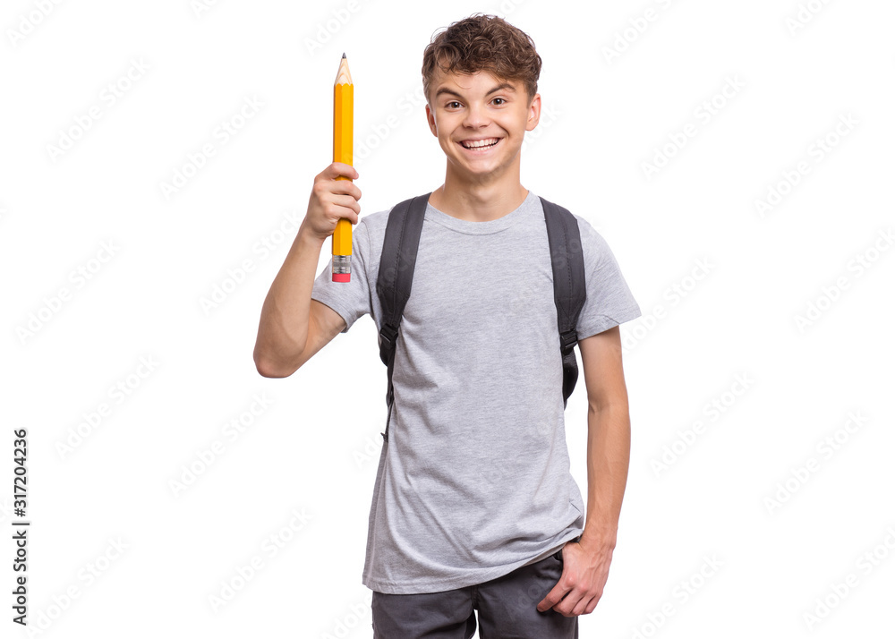 Smart student with backpack holding big pencil. Portrait of funny cute teen boy looking at camera, isolated on white background. Happy smiling child Back to school. Smart student with backpack holding big pencil. Portrait of funny cute teen boy looking at camera, isolated on white background. Happy smiling child Back to school.