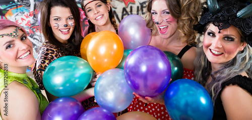 Group of women at Rose Monday making party with balloons