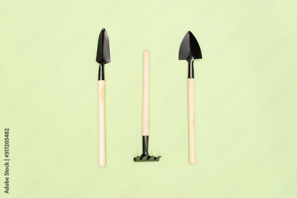 gardening tools on a green background gardening tools on a green background