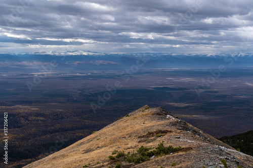 Mountain landscape in the eastern Sayan mountains with a view of the Tunka Valley