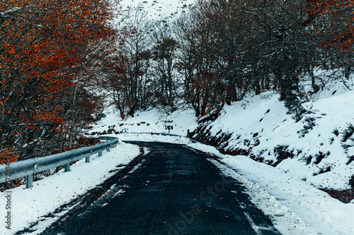 Snowy mountain road at sunrise in spain.