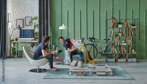 Two man living together, working at office style and modern green living room concept.