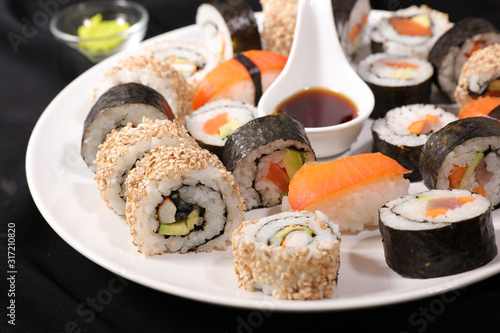 maki roll, sushi and soy sauce assortment