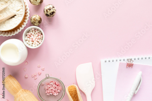Frame of food ingredients for baking on a gently pink pastel background. Cooking flat lay with copy space. Top view. Baking concept.