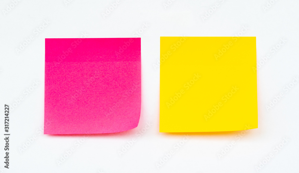 Empty yellow and pink paper stick note on a white background. Empty yellow and pink paper stick note on a white background.
