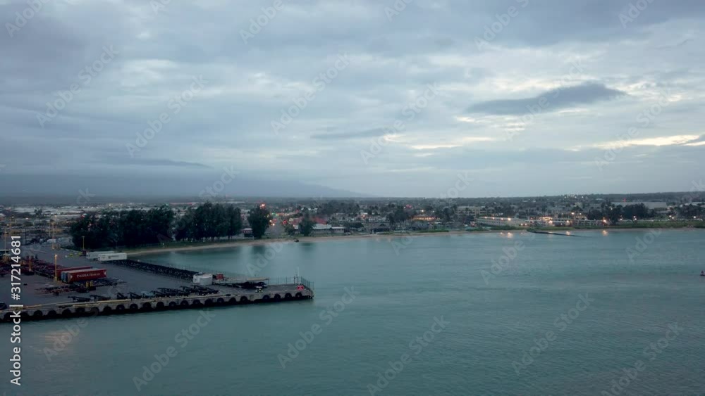 Cityscape from cruise ship in Maui, Hawaii. Kahului Harbor is located on Maui's north central coast. Kahului Harbor is primarily a commercial harbor and port. Cityscape from cruise ship in Maui, Hawaii. Kahului Harbor is located on Maui's north central coast. Kahului Harbor is primarily a commercial harbor and port.