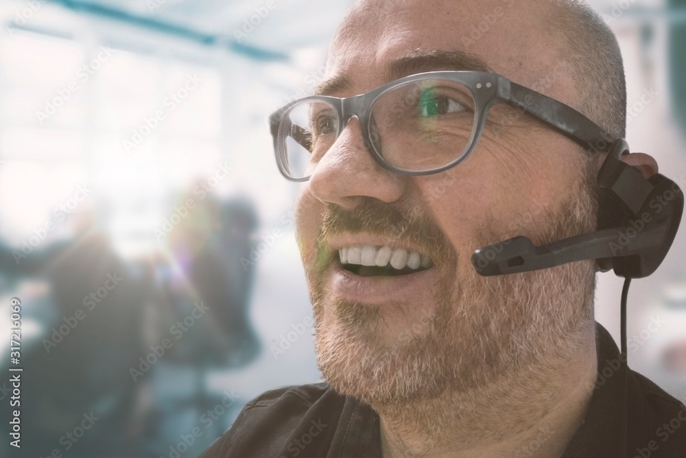 Male in a call center for the customer service office of a business. Empty copy space for Editor's text. Male in a call center for the customer service office of a business. Empty copy space for Editor's text.