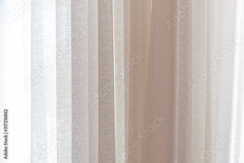 white curtain lay on window