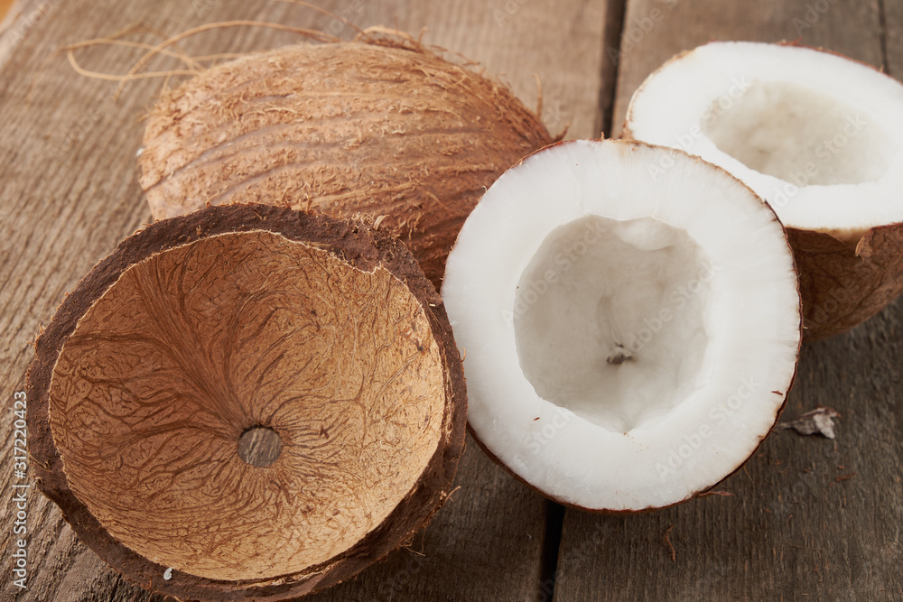 Coconut pieces pile on a wooden background