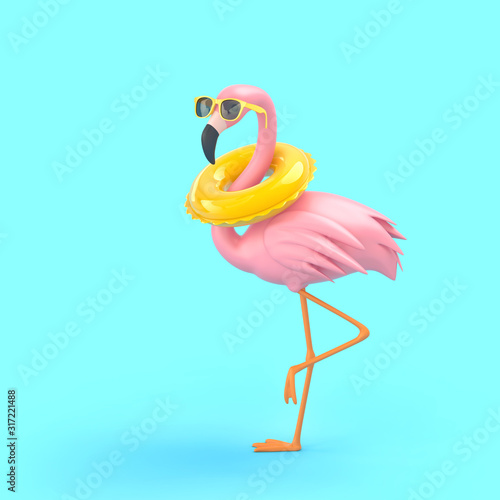 Funny flamingo in sunglasses with swimming ring on blue background photo