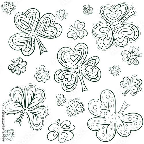 Set of doodle shamrock leaves different shape and decoration. Hand drawn Vector Illustration. Green and white line art.