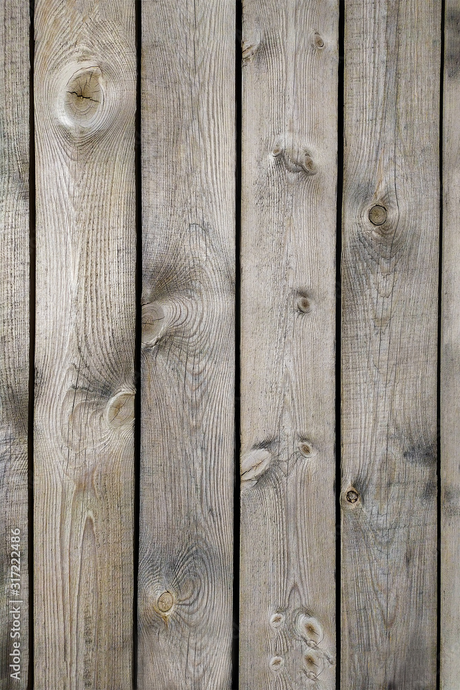 Naklejka premium Empty vintage wood background with texture of flat gray boards - natural wooden surface of fence. Light brown aged planks texture.