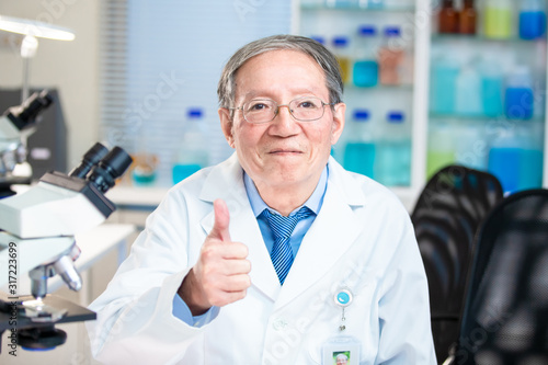 scientist has thumb up gesture