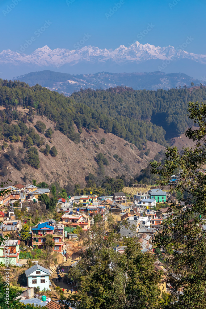 Nepali village in the hills. Great Himalaya Range in the backdrop