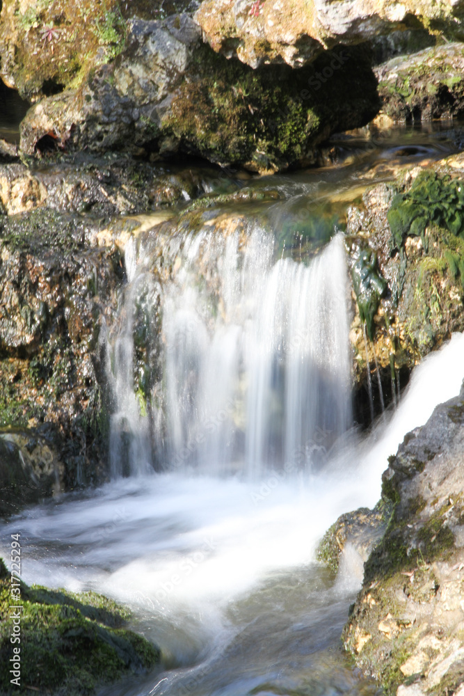 Waterfall in Majolan park Blanquefort city in Bordeaux Gironde