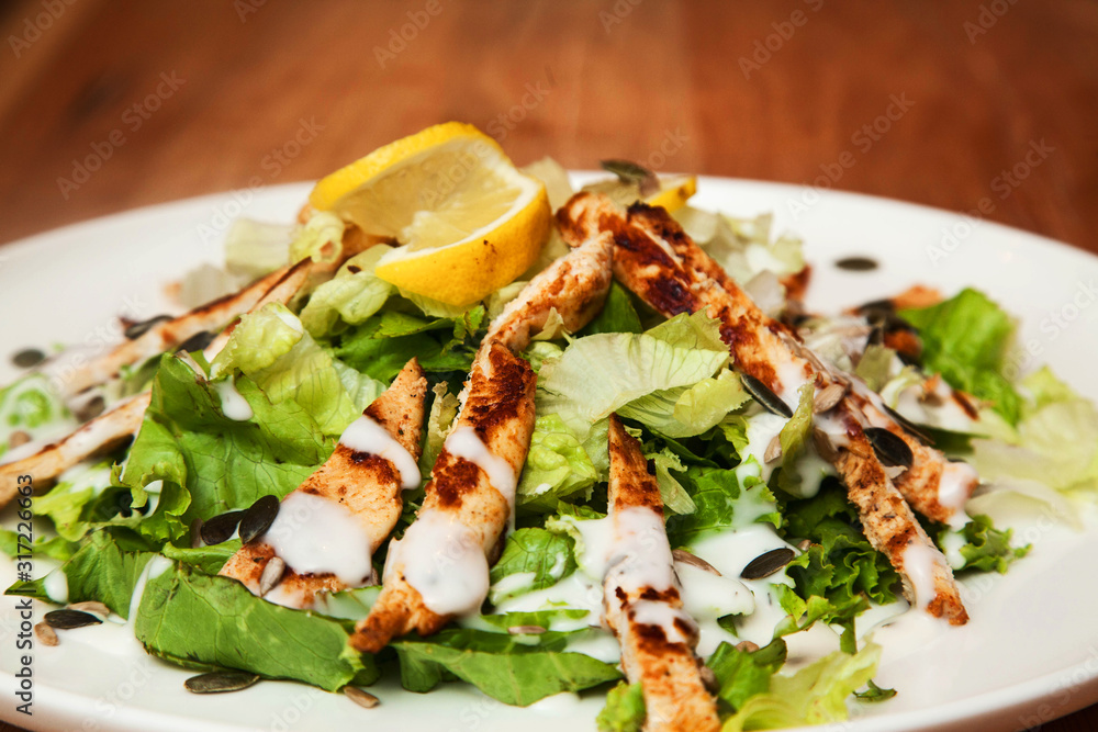 Grilled Chicken Breast fillet with fresh tomatoes vegetables salad. concept healthy food. Grilled Chicken Breast fillet with fresh tomatoes vegetables salad. concept healthy food.
