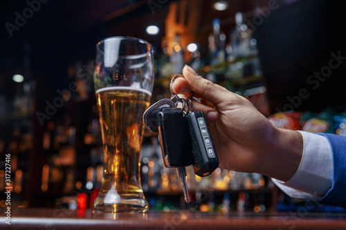 Do not drink and drive Cropped image of drunk man talking car keys