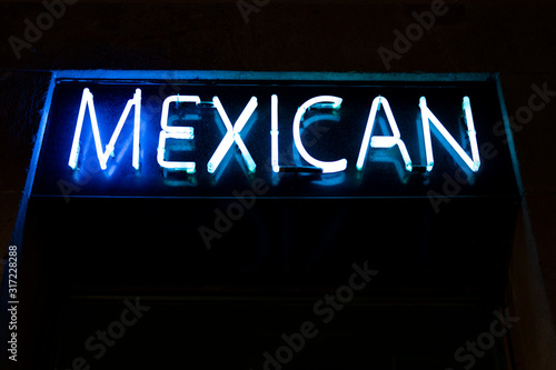 Neon panel with the word Mexican written in blue.