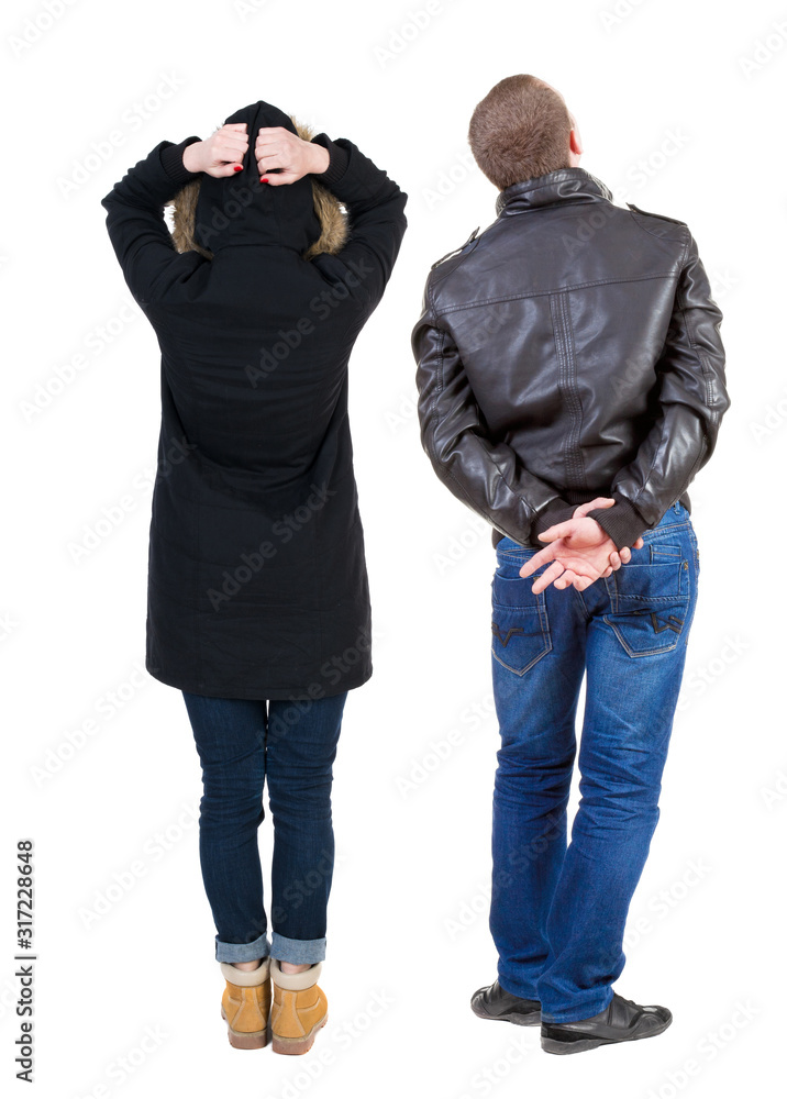 Back view of couple in winter jacket. Back view of couple in winter jacket.
