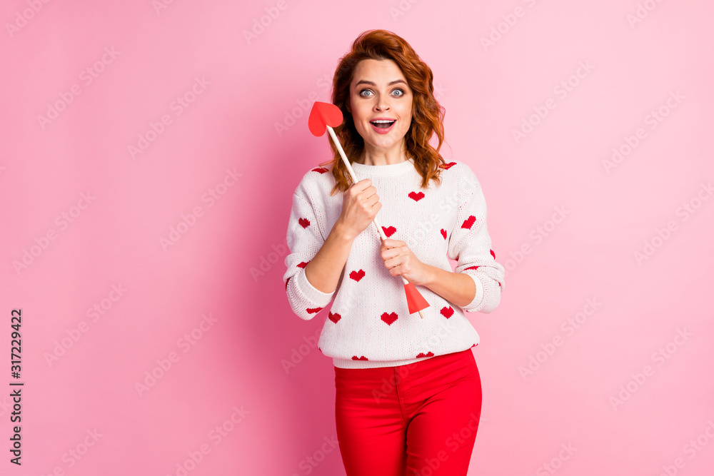 Portrait of her she nice attractive lovely pretty cute amorous glad cheerful cheery wavy-haired girl angel holding in hands arrow first date aim goal match isolated on pink pastel color background Portrait of her she nice attractive lovely pretty cute amorous glad cheerful cheery wavy-haired girl angel holding in hands arrow first date aim goal match isolated on pink pastel color background