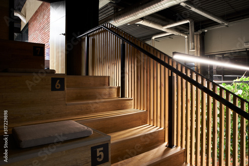 Wooden modern staircase in the loft style indoors