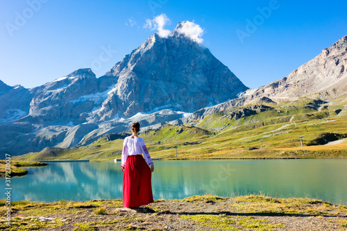Young girl dancing in the mountains