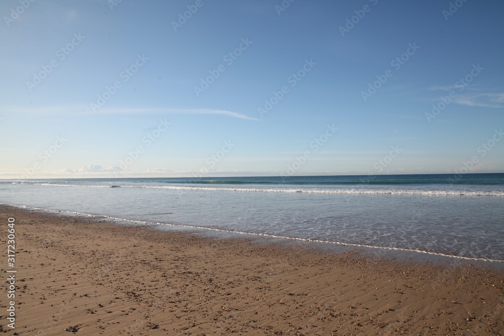Low tide on Spanish beach in the winter Low tide on Spanish beach in the winter