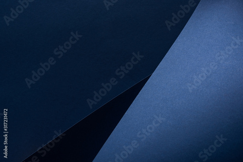 top view of curved blue paper background