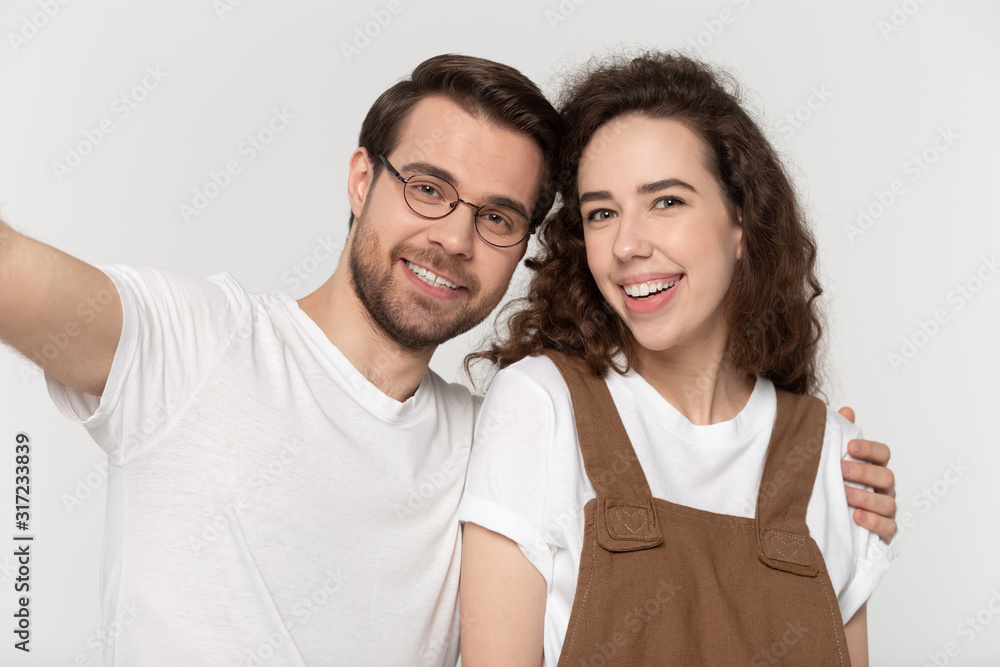 Happy millennial loving smiling couple taking selfie shot. Happy millennial loving smiling couple taking selfie shot.