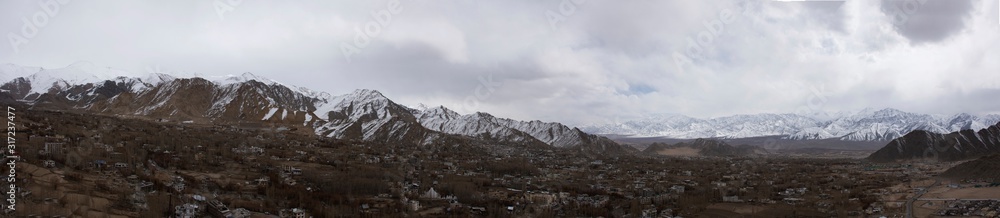Panorama view landscape and cityscape of Leh Ladakh Village with high mountain range from viewpoint Tsemo Maitreya Temple or Namgyal Tsemo Monastery while winter season in Jammu and Kashmir, India