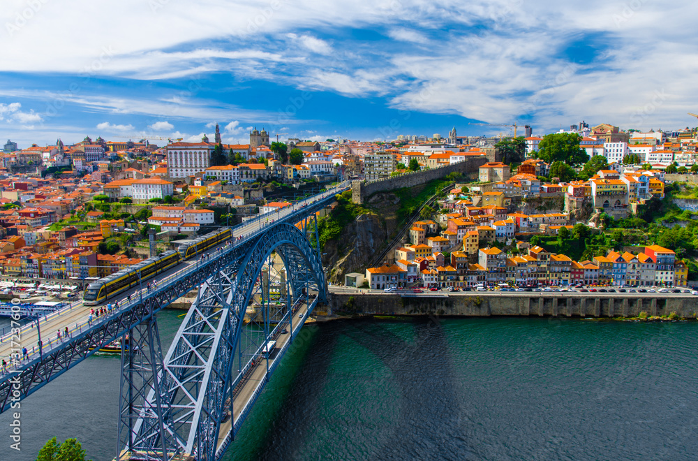 Portugal  Porto panorama, The Eiffel Bridge, Ponte Dom Luis,  Bridge Ponti Di Don Luis, Douro river, panoramic view of Porto city, Porto in June, white clouds at summer blue sky in Porto