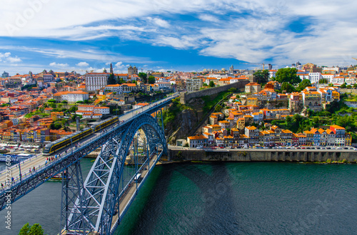 Portugal Porto panorama, The Eiffel Bridge, Ponte Dom Luis, Bridge Ponti Di Don Luis, Douro river, panoramic view of Porto city, Porto in June, white clouds at summer blue sky in Porto