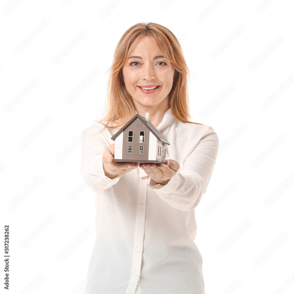 Female real estate agent with model of house on white background Female real estate agent with model of house on white background