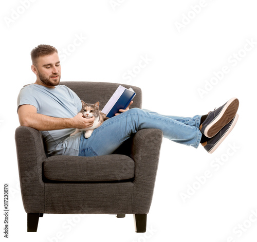 Man with cute cat reading b...