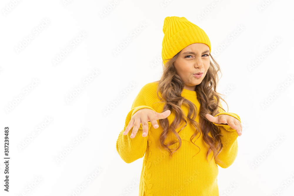 Happy caucasian girl in yellow hat and hoody refuses isolated on white background Happy caucasian girl in yellow hat and hoody refuses isolated on white background