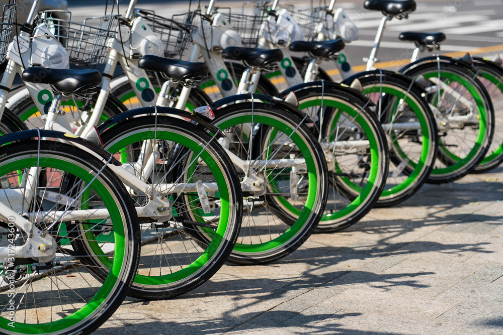 Public bicycle rental station in Seoul ,South Korea. Close up image of bicycle wheels.