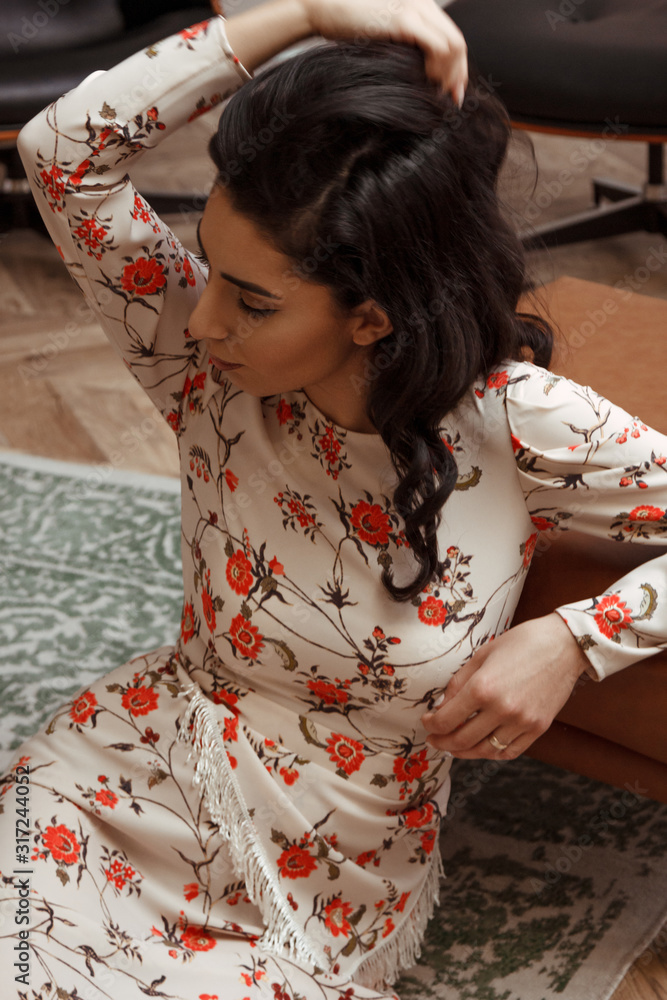 Beautiful young woman wearing floral print dress Beautiful young woman wearing floral print dress