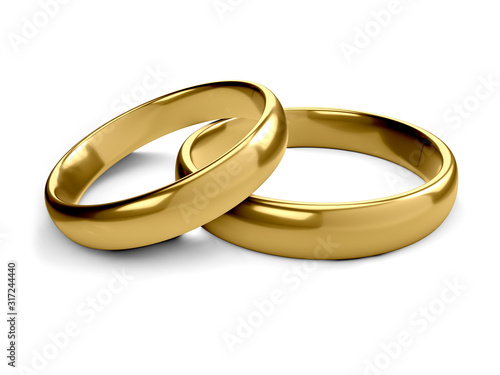 Wedding gold rings lie on each other