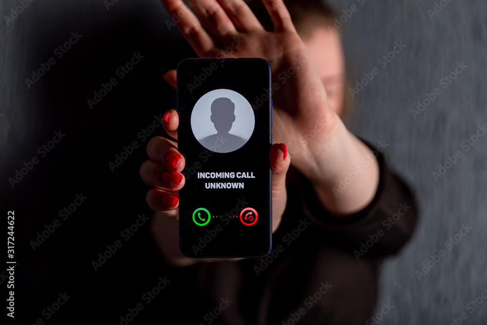 Phone call from unknown number. Scam, fraud or phishing with smartphone  concept. Prank caller, scammer or stranger. Woman answering to incoming  call. Hoax person with fake identity Stock-Foto | Adobe Stock