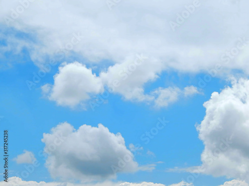 light blue sky with clouds, horizontal photo