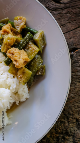 traditional indonesian culinary food. sayur lodeh in a plate with white rice photo