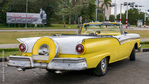 back of a yellow convertible cuban classic car 
