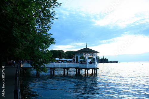 Obraz na płótnie Bregenz / Austria - June 06 2019: Restaurant on Harbor Bridge on the lake in Bregenz, Austria. w salonie