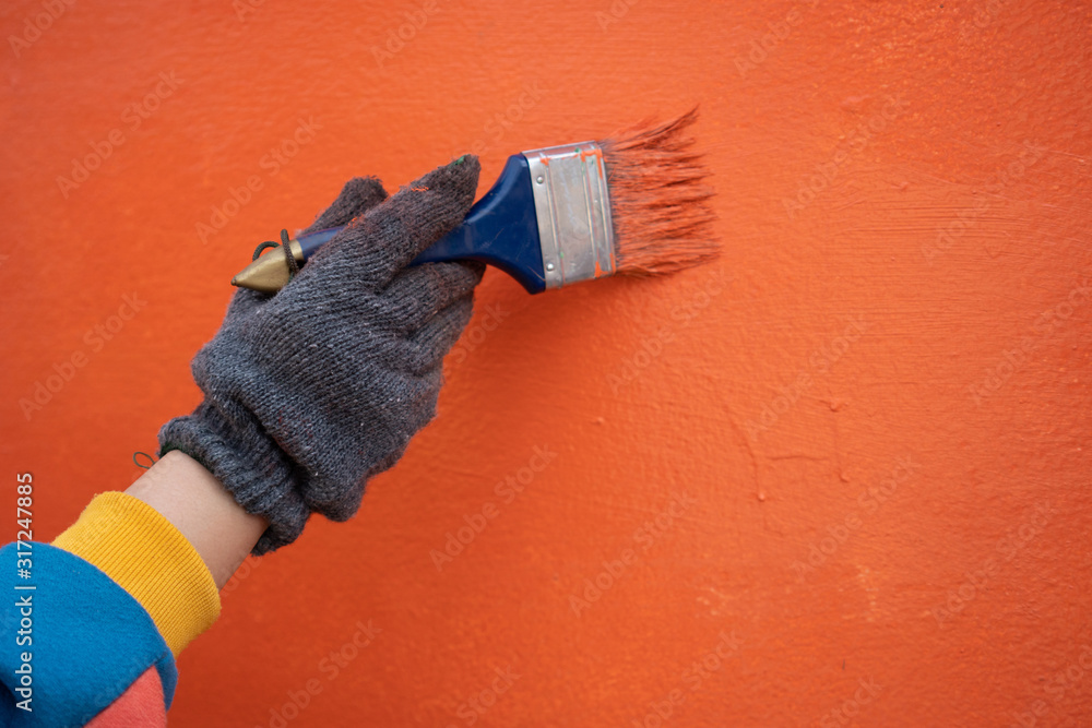Painter labor Paint the wall using paint plots and rollers. Concepts of work, labor, painting
