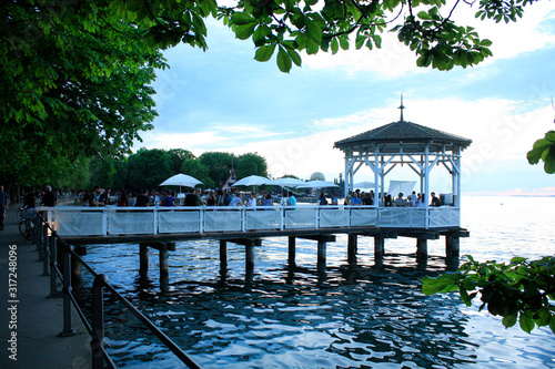 Obraz na płótnie Bregenz / Austria - June 06 2019: Restaurant on Harbor Bridge on the lake in Bregenz, Austria. w salonie
