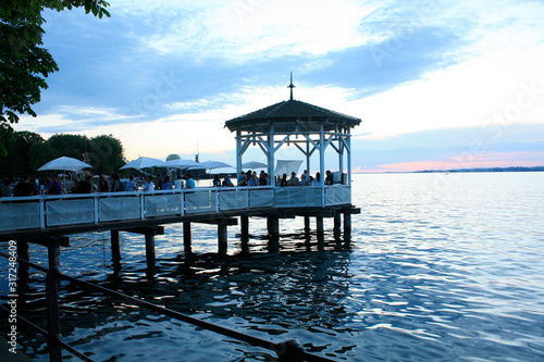 Obraz na płótnie Bregenz / Austria - June 06 2019: Restaurant on Harbor Bridge on the lake in Bregenz, Austria. w salonie
